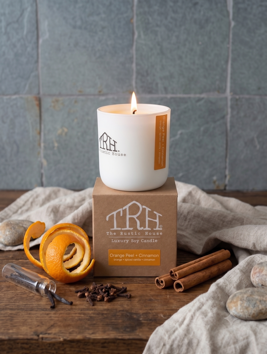 Orange Peel + Cinnamon candle in a styled lifestyle setting