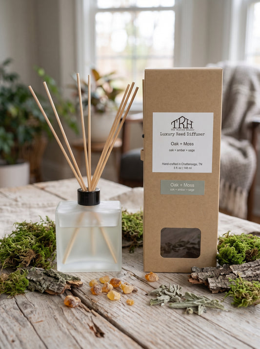 Oak + Moss reed diffuser in a styled lifestyle setting