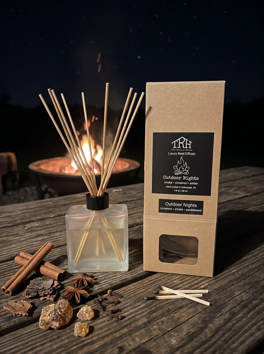 Outdoor Nights reed diffuser in a styled lifestyle setting