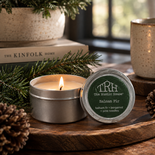 Balsam Fir travel tin in a styled lifestyle setting