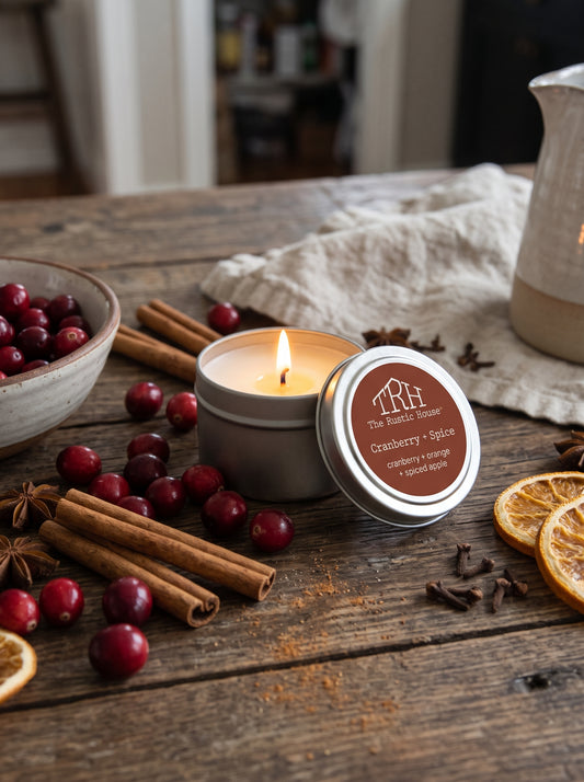 Cranberry + Spice travel tin in a styled lifestyle setting